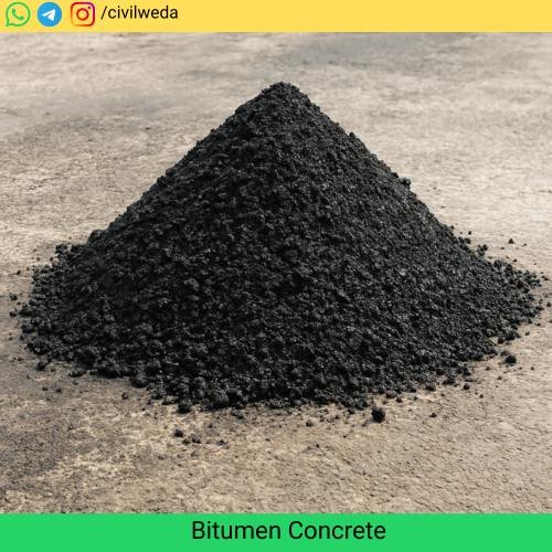 A large mound of freshly laid bitumen concrete placed on a construction site surface, showing the rough black texture of the mix.